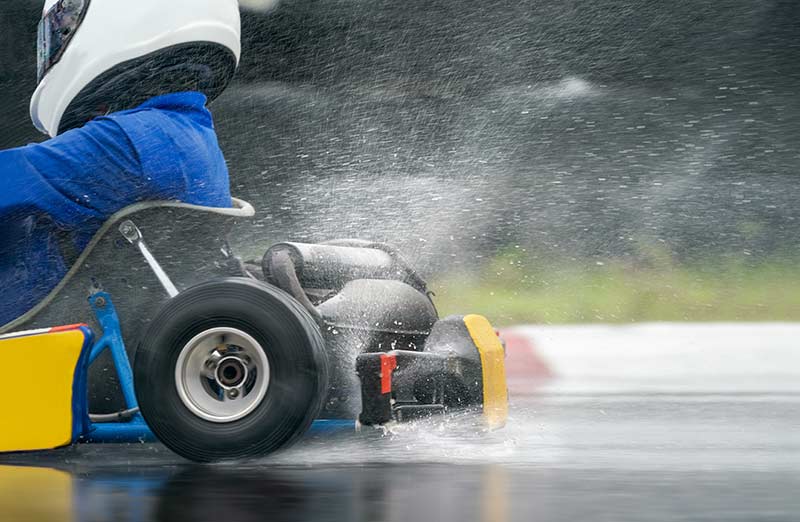 go kart flies through rain