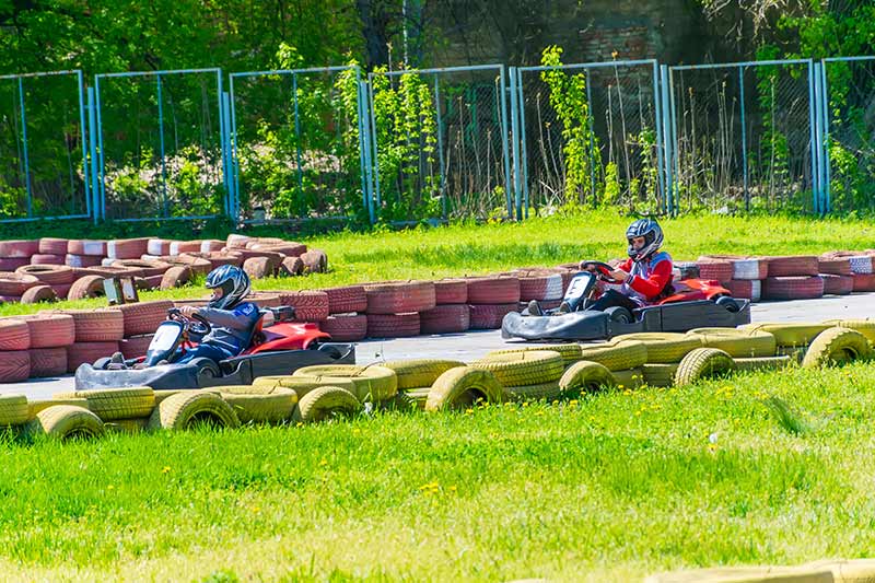 drivers race around go kart track
