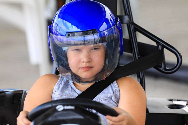 girl readies to take off in a go kart