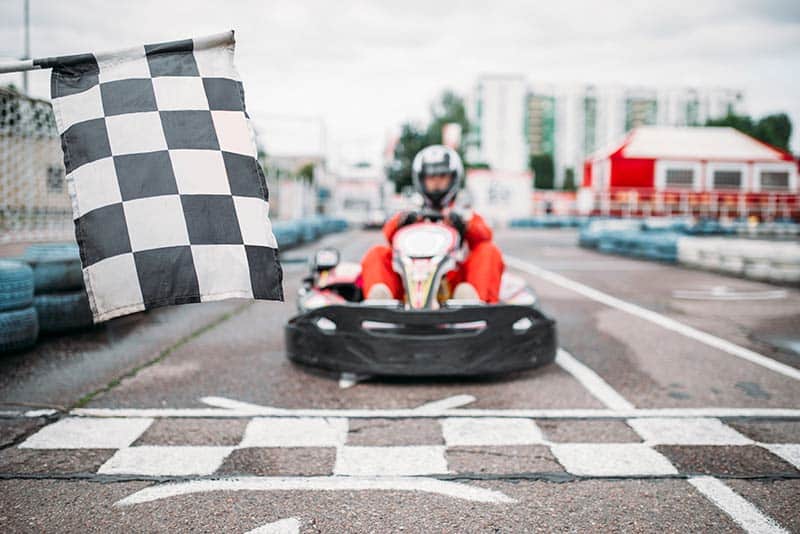 go kart driver waits for flag